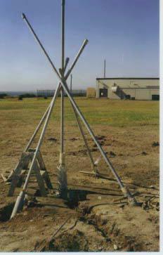 Figure 3. GPS site installation. Deeply anchored, drilled braced monument installed at Cape Blanco, Oregon.