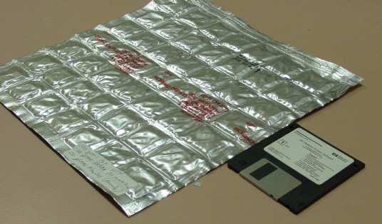 Figure 6. Photograph of Packet Containing PCM Showing Thickness 4 Hour Time Shift Degrees F.
