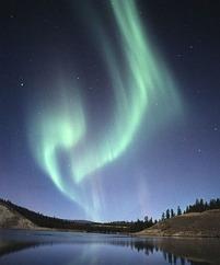 penetrates the geomagnetic field at the poles, forming the aurora at high latitudes