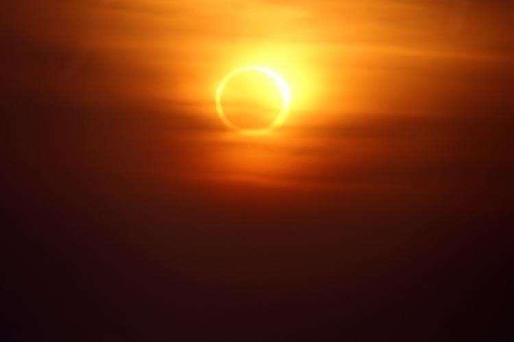 An annular solar eclipse happens when the Moon covers the Sun s center, leaving the Sun s visible outer edges to form a ring of fire or annulus around the Moon.