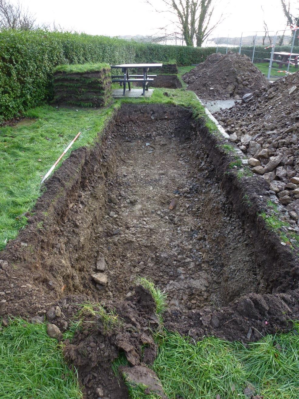 Figure 10: Trench 3A following partial excavation of redeposited boulder clay (307), looking southeast. For health and safety reasons excavation was halted after this photograph was taken. Scale 2.