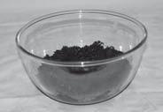 Put a layer of soil in the bottom of a clear bowl. Padd a small plant and water it well.