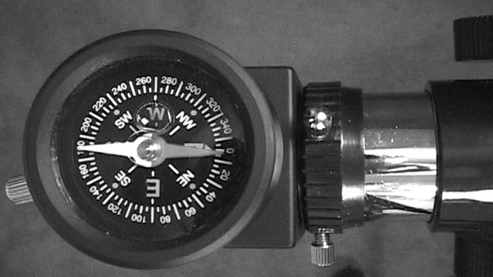 Fig. 13: Move the optical tube until the tube points North on the compass.