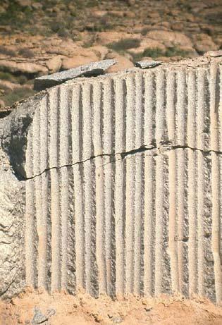Rock Behaviour Under High Stress Figure 3 Stress-induced fractures sub-parallel to the surface and to the quarry face A compressive stress in the near surface rock will induce extension strains in