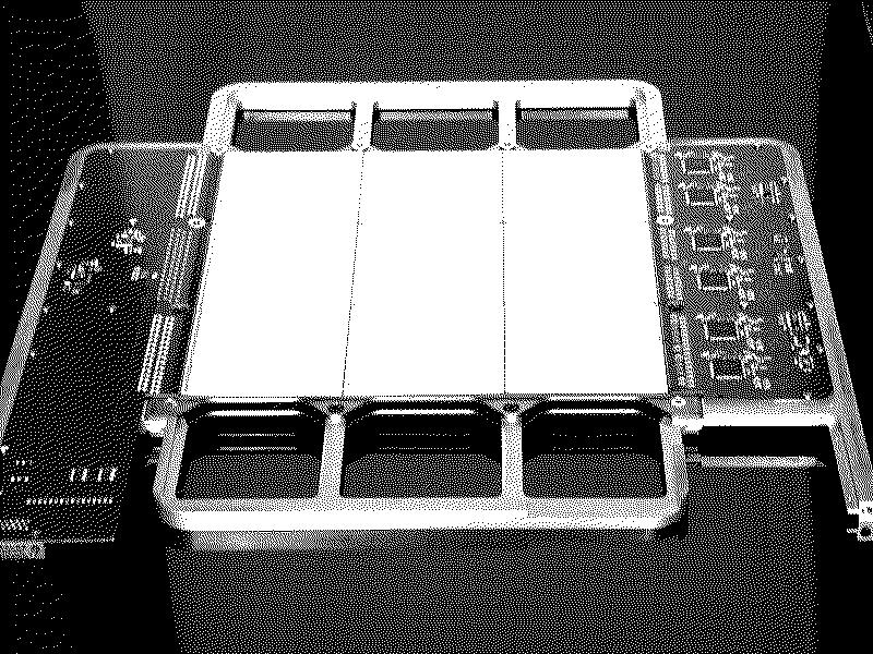 Fig. 1. Picture of one detection module of the calorimeter. The silicon detectors and front-end electronics mounted on the upper front-end board of the module are visible.