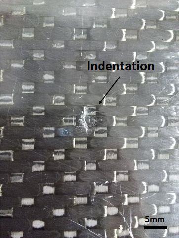21b shows the indentation of a postimpacted P#2 specimen tested at 25 J impact energy. As shown in Fig.