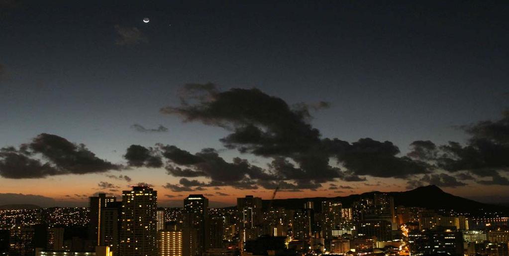 Crescent Moon and Spica at sunrise with Diamond Head in the background and Honolulu in the foreground. By David Nemo, His first day on vacation in Hawaii and still running on PST.