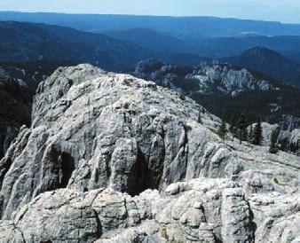 What does the landform and its rock composition tell you about the geological history of