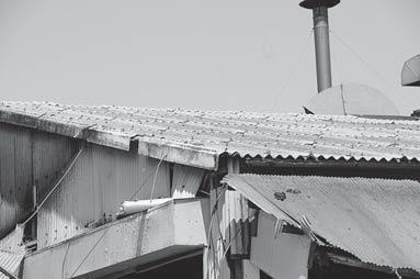 Figure 4. Roof boards including Asbestos Figure 5. The boards including Asbestos in the stockyards of rubble 3.