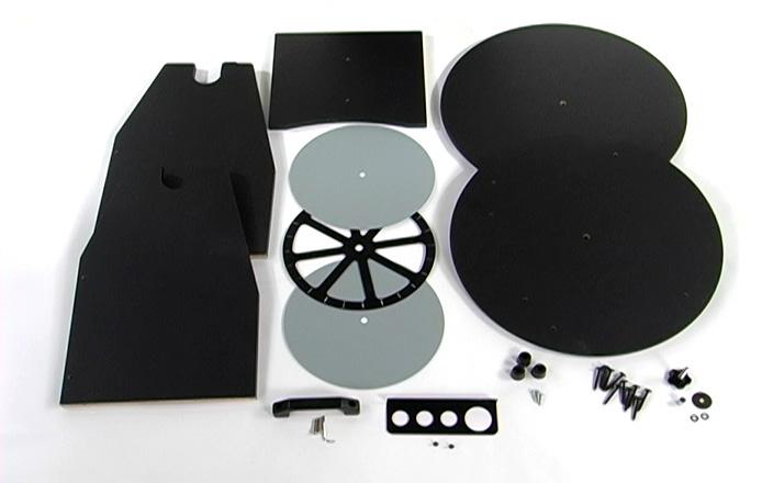 ASSEMBLY OF YOUR Unbox and gather the pieces for base assembly. You will need: a. Base Sides (2) b. Base Front c. Base Plates (2) d. Bearing Plates (3) e. Handle (and (2) silver Allen screws) f.