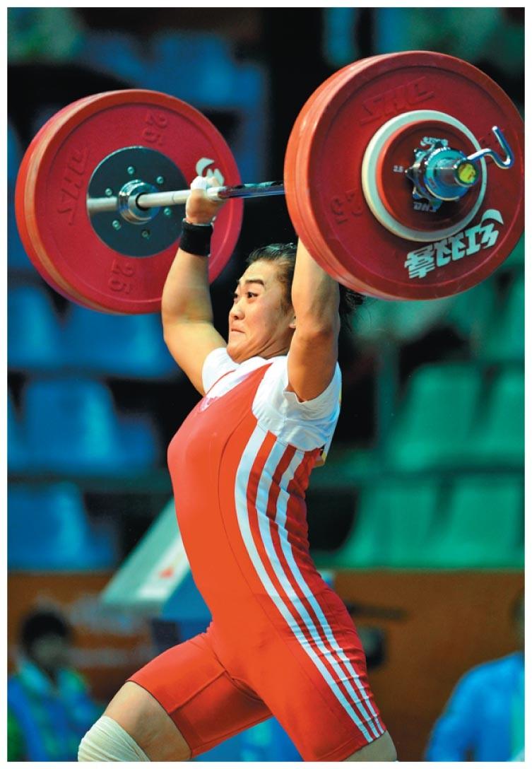 Work, Continued-1 Example: a weightlifter raising a barbell from the