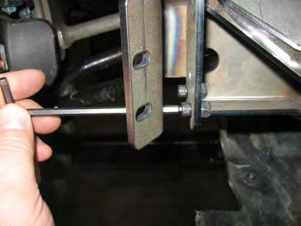 Lift lower plastic guard up against the lower plow mount bracket and mark