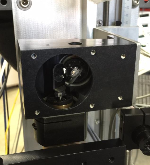 FIG. SM2. Photographs of 18-W laser for laser heating manipulation (left) and scanning mirror housing assembly (right).