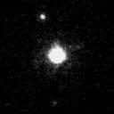 Haumea (center) and its two moons, Hi iaka (above) & Namaka