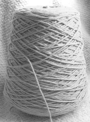 due to high friction less fibrils produced in cotton yarn as compared to the wool yarn its due to natural crimp which