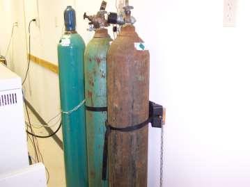 Compressed Gas Cylinders Store cylinders upright Secure each cylinder with a chain or