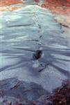 EFFECTS OF LIQUEFACTION sand boils - sand-laden water can be ejected from a buried liquefied layer and erupt at the surface to form sand volcanoes; the surrounding