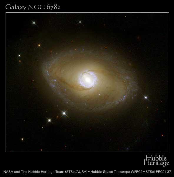 12 Fig. 11. A galaxy (NGC 6782) with inner and outer rings, from the Hubble Space Telescope. member galaxies.