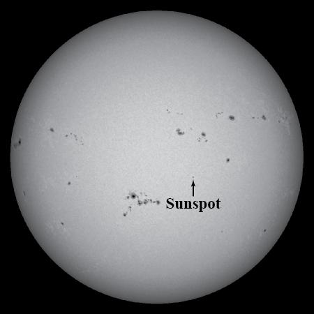 The image at right shows a picture of the Sun. The dark spots located on this image are sunspots.