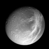 Iapetus orbits farther out, but