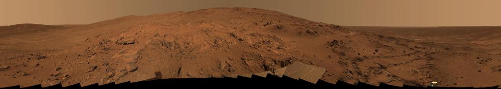 Atmosphere on Mars Mars has a rocky, dry terrain with huge volcanoes and deep valleys.