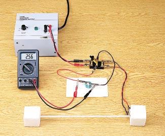 When your teacher has approved your circuit, turn on the power supply and close the switch to the left in order to charge the capacitor. While the capacitor is charging, watch the voltage meter.