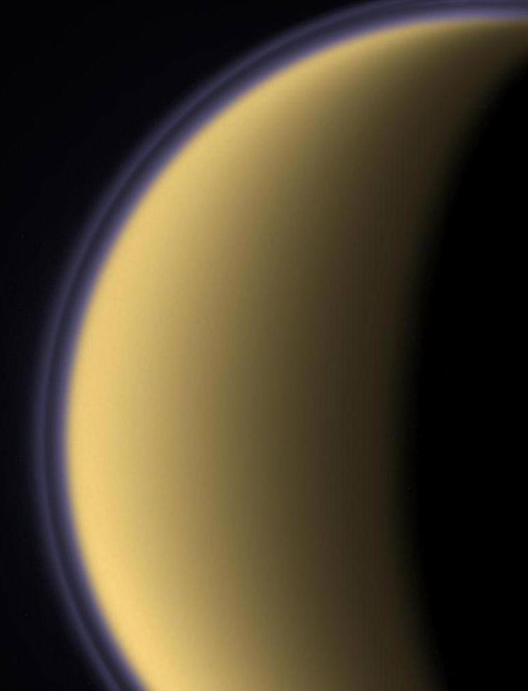 Titan s Thick Atmosphere Surface temperature: 94 K (-290 F) Pressure: 1.5 bar (1.