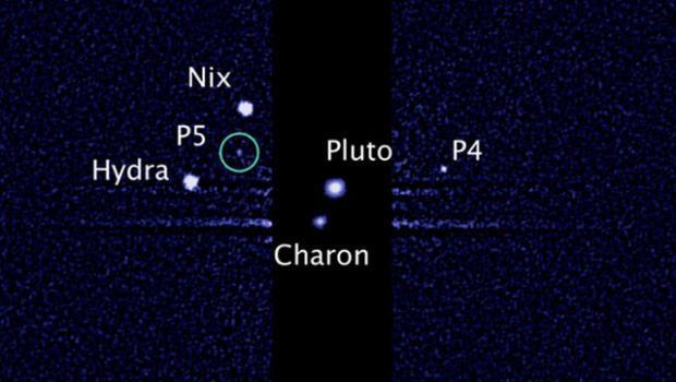 A recent Hubble telescope image of Pluto and its 5 satellites The name of the satellite P4 is Kerberos.