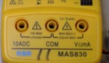 Note that the DMM has terminals marked as + and - or COM on it. These markings indicate the reference current direction for the meter.