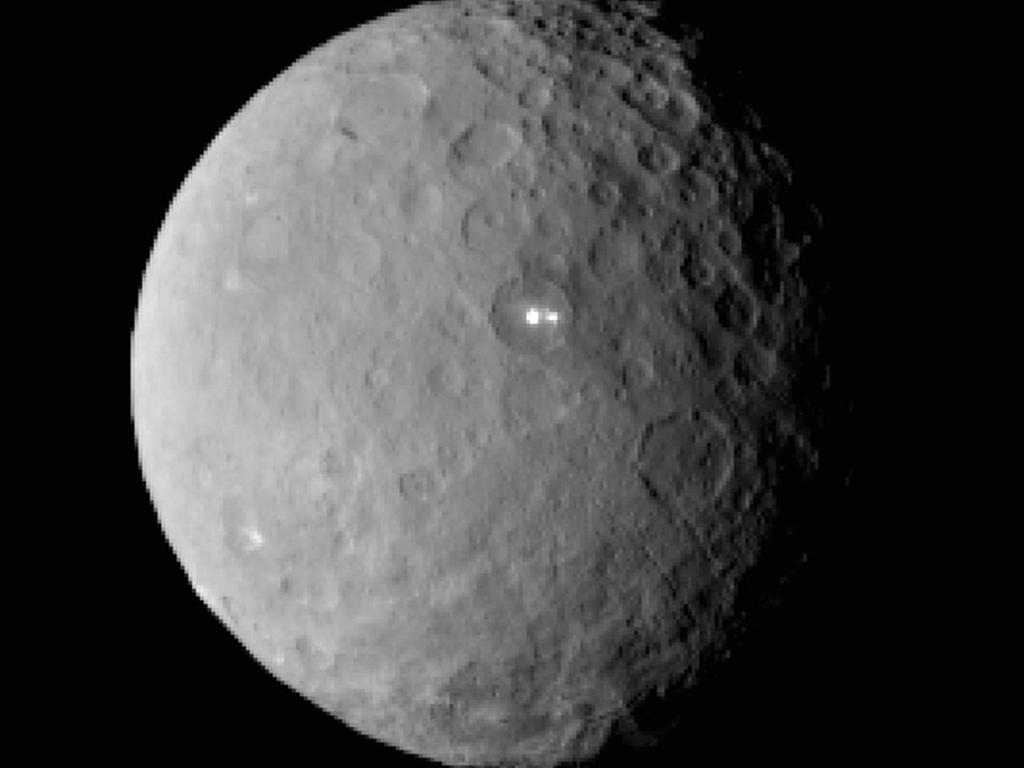 Ceres (largest object in asteroid belt) ~600 mi Orbits sun Round
