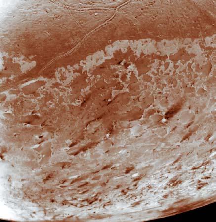 An erupting ice volcano on Triton Voyager picture Volcanic plume rises 8 km above surface extends 140 km downwind. due to sunlight thawing surface.