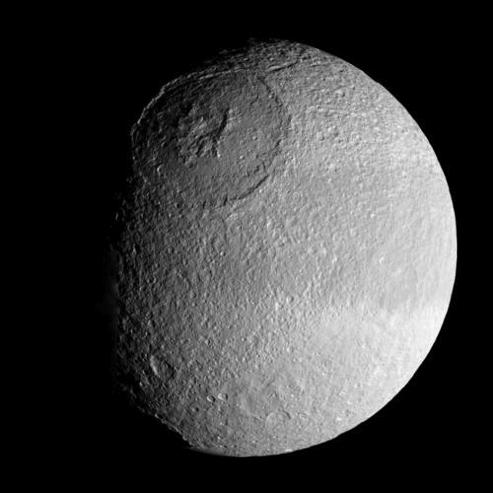 Tethys Iapetus: Bright ices Dark surface patches
