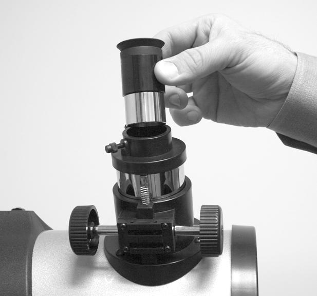 Insert the eyepiece: Remove the supplied 25mm or 26mm eyepiece (D) from its container and place it in the diagonal prism (refractor models only; see Fig.