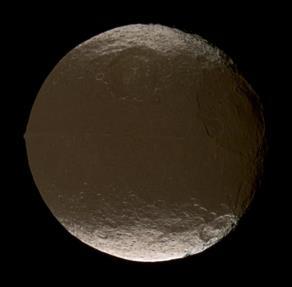 Iapetus Diameter = 1,460 km (907 mi) Coated with black dust on