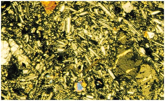 Photomicrograph of Basalt Classification of Igneous Rocks Based on Mineral Composition and Texture Textures- reflect rate of cooling Phaneritic Pegmatite Aphanitic Porphyritic Phaneritic- mineral