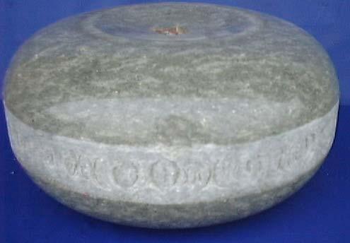 250m high x 600m across) A curling stone made from
