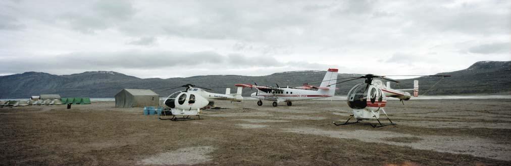 Fig. 25. The GGU/GEUS base camp at Centrumsø, Kronprins Christian Land. Two small helicopters transport two-person geological field teams to new camp sites at about 6 7 day intervals.