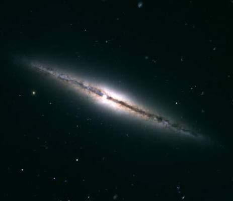 If this is a spiral galaxy, where is its disk? A. we are seeing it edgeon, so it appears flat B.