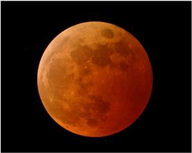 This total solar eclipse was visible from the northern tip of Australia on November 13, 2012. The moon appears orange red in a total lunar eclipse on October 27, 2004.