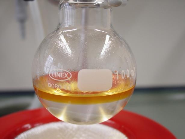 Distill the mixture, monitoring the temperature, until no more oily droplets come over (tdistillate 115 ºC). 8.