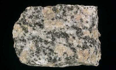 intrusive or plutonic igneous rocks: magma cools and solidifies beneath the surface (i.e. gabbro, granite).