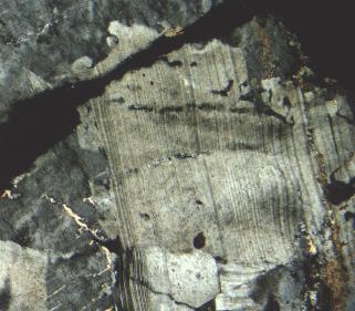 8 Cape Ann, Massachusetts Fig. 7. In this photomicrograph, microcline (gray, top and left side) has replaced deformed plagioclase (tan, center) in the Cape Ann granite.
