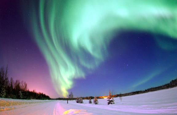 Aurora Borealis (Northern Lights) Joshua Strang, USAF, Wikipedia Energetic solar wind particles that enter Earth s atmosphere can create auroras 35 Auroras are the interaction between the charged