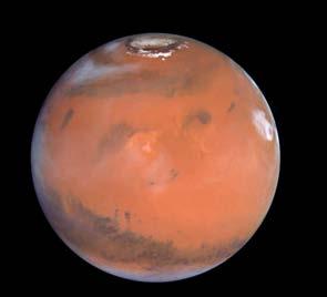 The next planet is Mars. This planet has a reddish color and hardly any air. The red color is caused by rust in rocks. It is cold on Mars. Scientists have learned that Mars has ice at its poles.