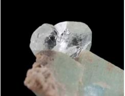 El Paso County: Crystal Park (first US find, about 1880), as large (up to 3 inches across) broken rhombohedral crystals found in the 1880s, with topaz, zircon, amazonite, and smoky quartz.
