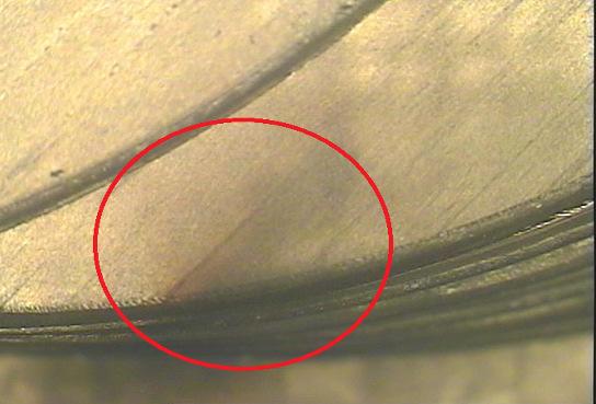 4, 5, 6). The stiffness loss may decrease the life of a composite structure significantly. Fig. 6. Delamination (test 15) Other defects such as wear of cutting tool (Fig.