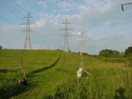 FIGURE IX. CLEARANCE MONITORING STATION HYDRO ONE 230KV LINES (SONAR DEVICE IN BLUE) PHOTO BY: KINECTRICS INC. TORONTO, CANADA 4.