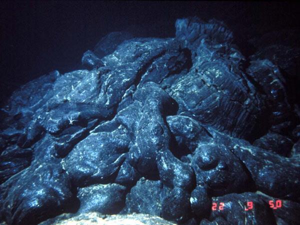 Strange rocks shaped like pillows or like toothpaste squeezed from a tube have been found These rocks can form only when molten material hardens quickly