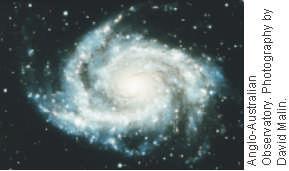 Spiral Galaxies As shown in Figure 18A, spiral galaxies are usually disk-shaped, with a somewhat greater concentration of stars near their centers. There are numerous variations, though.