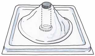 2. Work with your group to set up your volcano model as shown below by following these steps: a. Gently push the clear tube into the mouth of the white volcano cone. b. Set the base of the clear tube into the hole of the square plastic tray.
